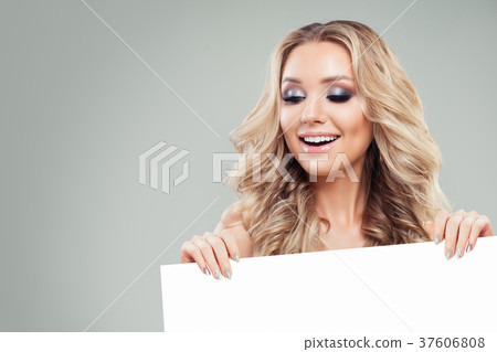 Young Smiling Woman Holding White Board Paper  37606808