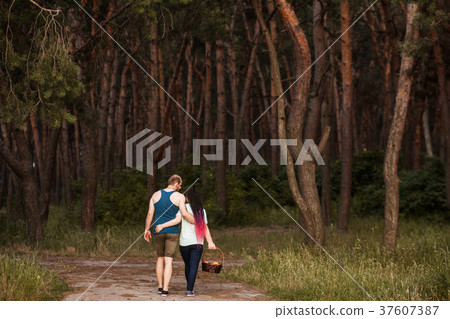 Couple walk forest picnic love concept. 37607387