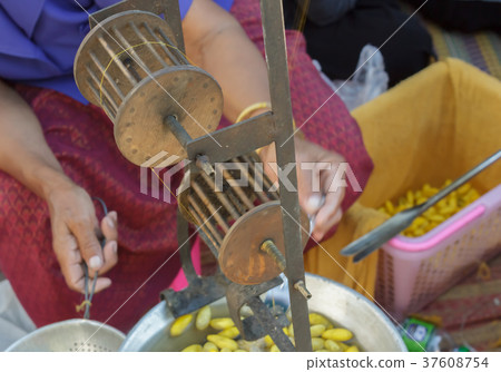 Women are making yarn from silk Women are making yarn from silk 37608754
