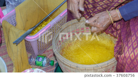 Women are making yarn from silk Women are making yarn from silk 37608756