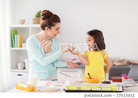 happy mother and daughter baking at home happy mother and daughter baking at home 37613852