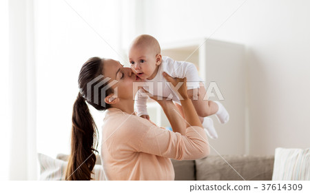 happy mother kissing little baby boy at home 37614309