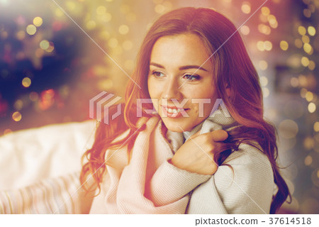 happy young woman with plaid at home for christmas happy young woman with plaid at home for christmas 37614518