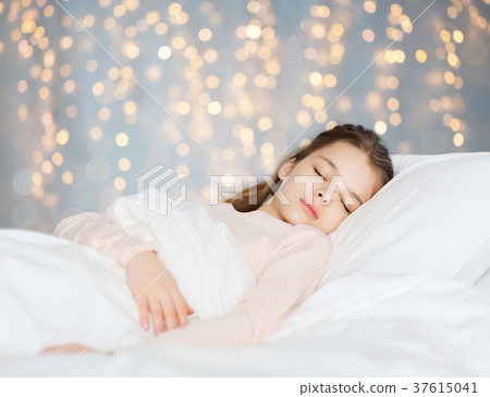 girl sleeping in bed over holidays lights girl sleeping in bed over holidays lights 37615041