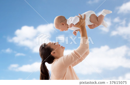 happy mother playing with little baby boy over sky happy mother playing with little baby boy over sky 37615075
