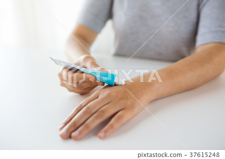 close up of hands with cream or therapeutic salve 37615248