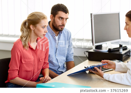 couple visiting doctor at family planning clinic 37615269