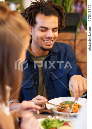 happy couple eating at restaurant happy couple eating at restaurant 37615301