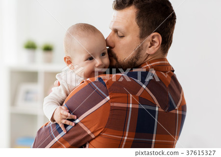 happy father kissing little baby boy at home 37615327