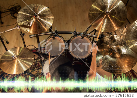 male musician playing drum kit at studio male musician playing drum kit at studio 37615638