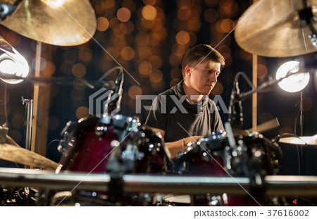 male musician playing drum kit at concert male musician playing drum kit at concert 37616002