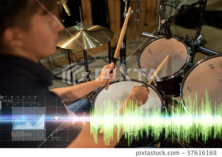 male musician playing drum kit at concert male musician playing drum kit at concert 37616168