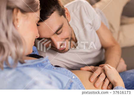 happy man with pregnant woman at home happy man with pregnant woman at home 37616173