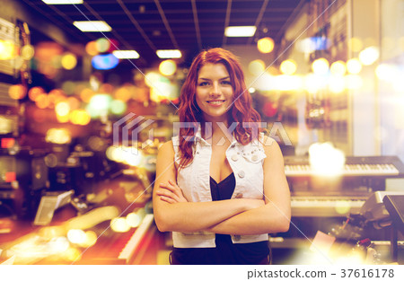 smiling assistant or customer at music store smiling assistant or customer at music store 37616178