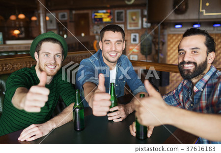 happy male friends drinking beer at bar or pub 37616183