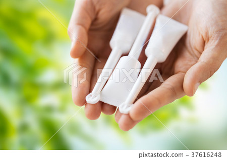 hand holding tubes of micro enema hand holding tubes of micro enema 37616248