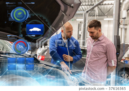 auto mechanic with clipboard and man at car shop 37616365