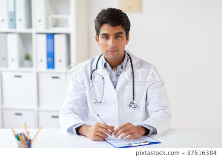 doctor with stethoscope and clipboard at clinic 37616384