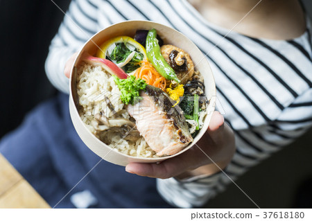 Woman with lunch box food business 37618180