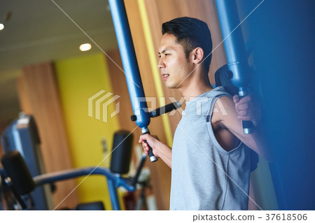 Men exercising in the gym 37618506