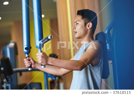 Men exercising in the gym 37618515
