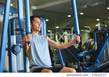 Men exercising in the gym 37618517
