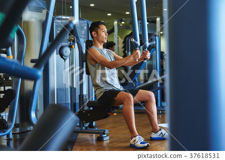 Men exercising in the gym 37618531