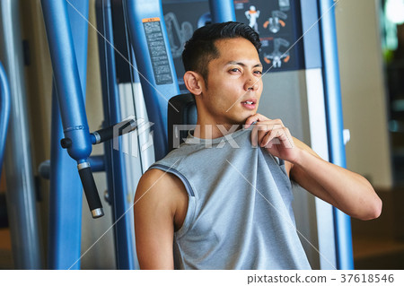 Men exercising in the gym 37618546