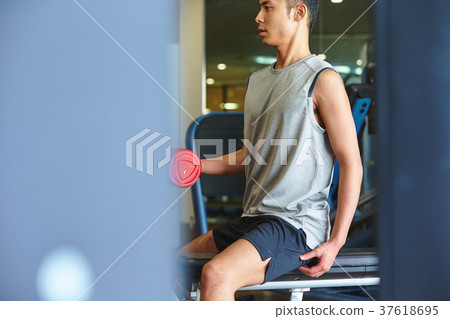 Men exercising in the gym 37618695