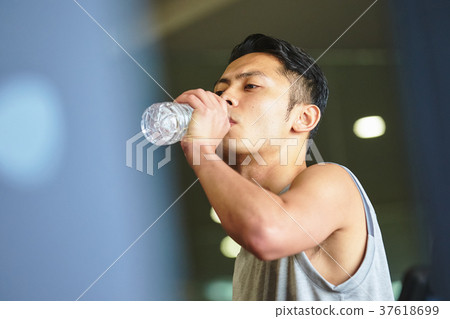 Men exercising in the gym 37618699