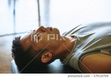 Men exercising in the gym 37618709