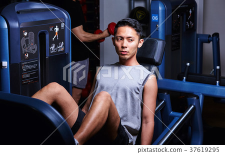 Men exercising in the gym 37619295