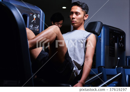 Men exercising in the gym 37619297