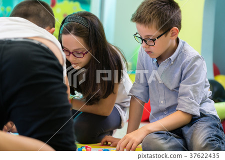 Cute pre-school boy and girl wearing eyeglasses Cute pre-school boy and girl wearing eyeglasses 37622435