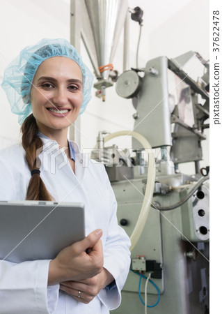 Portrait of quality control inspector smiling 37622478