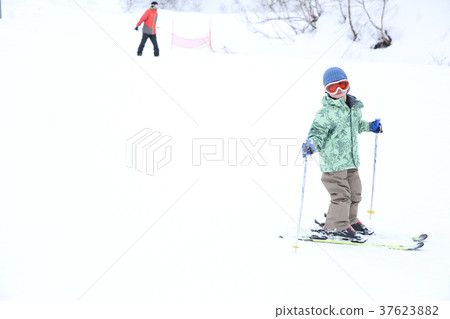 Children enjoying skiing 37623882