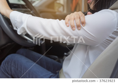 Close up of woman arm with pain - long driving on the way 37623923