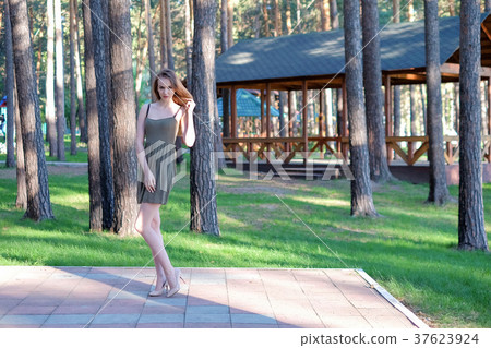 Beautiful girl posing in the park 37623924