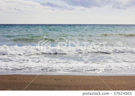Stormy winter Mediterranean sea and empty beach Stormy winter Mediterranean sea and empty beach 37624865