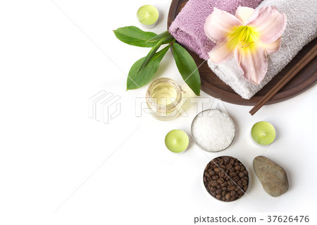 Spa setting of towel, flower on white background. Spa setting of towel, flower on white background. 37626476