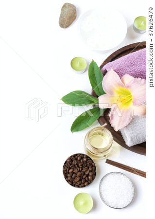 Spa setting of towel, flower on white background. Spa setting of towel, flower on white background. 37626479
