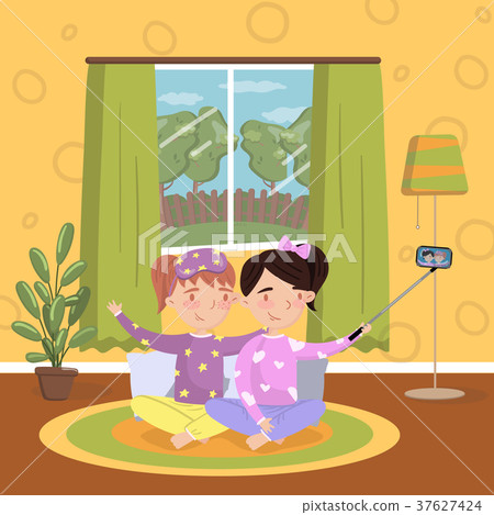 Two girls in pajamas making selfie in living room Two girls in pajamas making selfie in living room 37627424