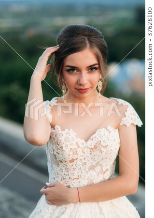 Young girl in wedding dress on city background at Young girl in wedding dress on city background at 37628100