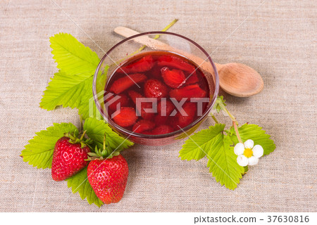 Fresh red strawberry and jam on textile background 37630816