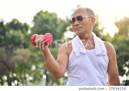 Asian Senior man lifting dumbbell. 37634216