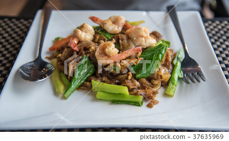 Stir fried flat noodle and shrimp Stir fried flat noodle and shrimp 37635969