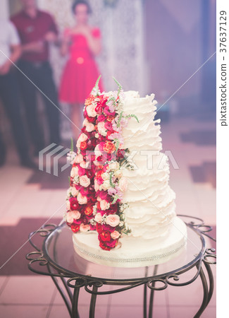 Luxury decorated wedding cake on the table Luxury decorated wedding cake on the table 37637129