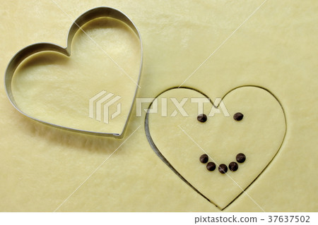 Love heart from dough with smile. Love heart from dough with smile. 37637502