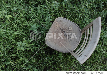 Old vintage chair in grass top view. Old vintage chair in grass top view. 37637503