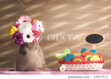 Flowers and colorful cookies with a banner Flowers and colorful cookies with a banner 37637512